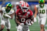 Indiana running back Kaelon Black (8) carries for a touchdown against Oregon during the second half of the Peach Bowl NCAA college football playoff semifinal, Friday, Jan. 9, 2026, in Atlanta.