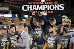 The Milwaukee Brewers celebrate after Game 4 of baseball's National League Championship Series between the Milwaukee Brewers and the Los Angeles Dodgers, Thursday, Oct. 15, 2026, in Los Angeles.