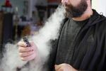 A person demonstrates use of a vape in this undated file photo.