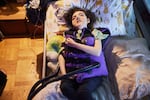 June Stracener wears a percussive vest, which uses oscillations to keep her airways clear and moisturized. June, 18, who has cerebral palsy and a rare seizure disorder, requires round-the-clock, hospital-level care.