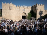Israeli marchers dance at Damascus Gate, the entrance to the Muslim Quarter of the Old City. Tens of thousands of Israelis marched through the streets of Jerusalem Wednesday for Jerusalem Day.