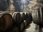 Champagne barrels line the deep, cool cellars of Charles Fourny’s estate in Vertus, France. Fourny says President Trump's impending tariffs has taken away his trust in the U.S. market.