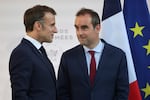 Then French Defense Minister Sébastien Lecornu (right) and France's President Emmanuel Macron talk at the end of an address by the president to army leaders in Paris on July 13.