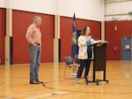 U.S. Rep. Val Hoyle, right, speaks to a crowd at a Springfield town hall alongside U.S. Sen. Jeff Merkley, left, in September 2026.