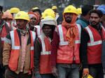 Construction workers gather near the new Ram temple in Ayodhya.