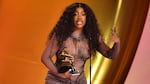 SZA accepts the best R&B song award for "Snooze" on stage during the 66th Annual Grammy Awards.