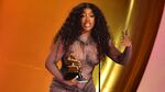 SZA accepts the best R&B song award for "Snooze" on stage during the 66th Annual Grammy Awards.