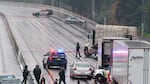 Portland police block off a portion of I-5 after an alleged carjacking and shooting Monday, Dec. 6, 2021.