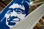 FILE - An Alaska Airlines aircraft sits in the airline's hangar at Seattle-Tacoma International Airport Wednesday, Jan. 10, 2024, in SeaTac, Wash.  Alaska Airlines briefly grounded all flights Wednesday, April 17,  due to a technical issue.