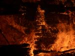 A house burns in Varnava village during a wildfire, north of Athens, Greece, on Sunday.