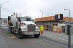 Cement trucks line up at a construction site in South Lake Union.