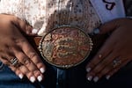 Cordeiro's custom-made belt buckle by Epic Saddlery, featuring the year and her name.