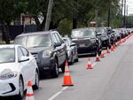 People wait in line during a baby formula drive to help with the baby formula shortage on Saturday in Houston.