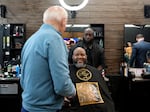 President Biden greets patrons and staff at the Regal Lounge barbershop and spa in Columbia, S.C., on Jan. 27.