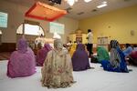 People sit in the prayer hall on a recent Sunday.