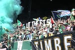 Members of the Timbers Army with a "Gut The Fish" sign ahead of the Portland Timbers' match against the Seattle Sounders at Providence Park in Portland, Ore., on May 12, 2024. The Timbers ultimately lost 2-1.