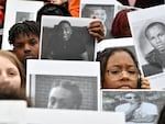 Students from Philadelphia hold photos of gun violence victims at a rally at the Pennsylvania Capitol pressing for stronger gun-control laws, March 23, 2023, in Harrisburg, Pa.