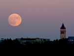 A supermoon rises over Washington, D.C., in November 2016. After this week's Strawberry Supermoon, there will be two more in July and August.