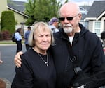 Judy and Tom Keegan embrace Tuesday, Sept. 3, 2024 in Fairview, where their home was recently destroyed when a plane crashed into it and three other homes. Tom was in the house recovering from shoulder surgery when the plane hit, “I just got blown around and then I came out, walked out through the broken glass,” he said. “And then my neighbor started taking care of me.”