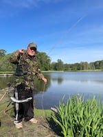 James Newton of Kelso, Washington, shows off the two rainbow trout he caught in Recreation Lake at Trojan Park on May 2, 2026.