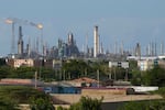 FILE - Flames rise from flare stacks at the Amuay refinery in Los Taques, Venezuela, Jan. 14, 2026.