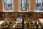 The downstairs reading room at the main branch of the Multnomah County Library, as seen from the stairwell.