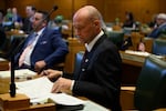 FILE — Rep. Greg Smith, R-Heppner, looks at papers on his desk in the state House in January 2025.