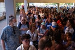 Hundreds line up to enter the Dr. Matthew Prophet Education Center to attend the meeting. The crowd, many of whom were barred entering when the building reached capacity, eventually pushed past the security team and made it inside.