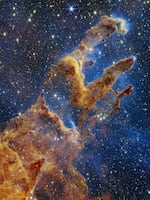The Pillars of Creation were first photographed by Hubble in 1995. Webb's image reveals countless newly formed stars glistening amongst the columns of gas and dust.