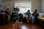 Gloria Contreras, right, watches the World Cup with her sons, Angél Vasquez Contreras, to her left, and Ivan Vasquez Contreras in their now-air conditioned Portland, Ore., home on June 23, 2026. 