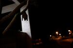 A bat hangs from a branch outside Brazil's state-run Fiocruz Institute at Pedra Branca state park, near Rio de Janeiro, Tuesday, Nov. 17, 2020. Bats are thought to be the original or intermediary hosts for multiple viruses that have spawned recent epidemics, including COVID-19, SARS, MERS, Ebola, Nipah virus, Hendra virus and Marburg virus.