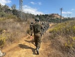 Israeli security forces, including military and police, declared a closed military zone around a olive grove and escorted activists and rabbis away from the area before detaining them near the Israeli settlement of Beitar Illit in the occupied West Bank.