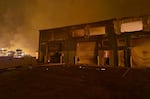 August 9: Smoke billows from flames near Lahaina as wildfires driven by high winds destroy a large part of the historic town of Lahaina, Hawaii.