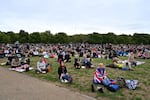 Well-wishers gather in Hyde Park where the State Funeral Service of Britain's Queen Elizabeth II will be shown on a large screen in London.