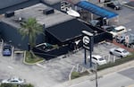 Law enforcement officials work at the Pulse nightclub in Orlando, Fla., on June 12, 2016, following a mass shooting. The shooter targeted gay patrons in what was a largely Latino crowd.