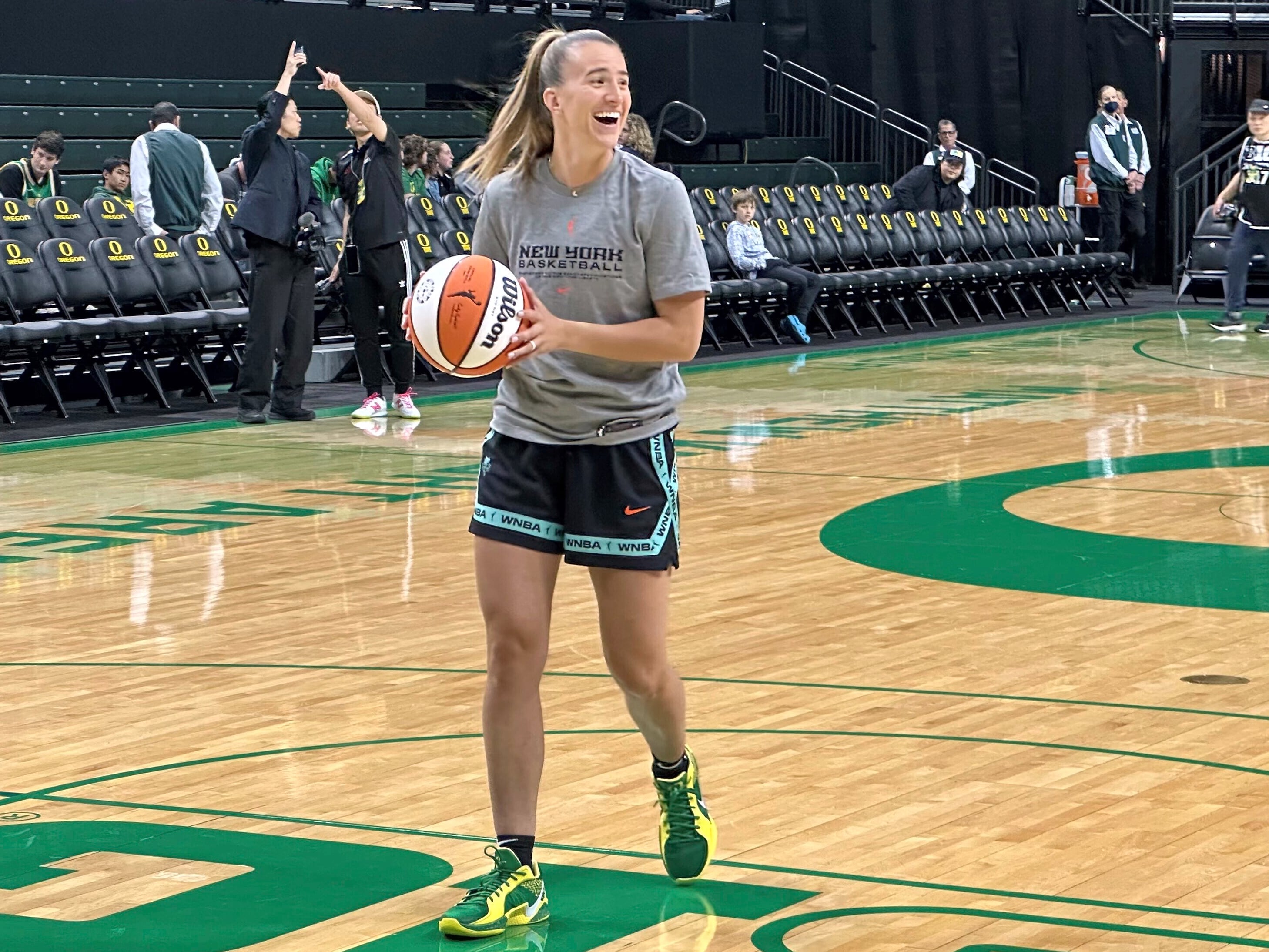 New York Liberty guard Sabrina Ionescu laughs during warmups before a preseason WNBA basketball game against the Toyota Antelopes, of Japan, in Eugene, Oregon, Monday, May 12, 2025.