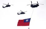 Helicopters fly over with Taiwan national flag during an inauguration celebration of Taiwan's President Lai Ching-te in Taipei, Taiwan, on May 20, 2024.