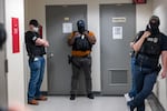 Federal agents patrol the halls of immigration court at the Jacob K. Javitz Federal Building in June 2025 in New York City.