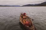 The character Qemtsna paddles across the Lake of Silence on her way to the end of the world.