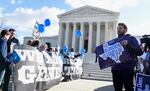 Pro-abortion rights protesters and anti-abortion protesters rally outside the Supreme Court in Washington.