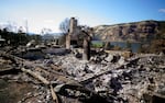 Cinderblocks, a chimney and ashes overlook the Columbia River Gorge.