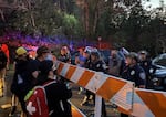 FILE - Protesters in front of a police barricade in Springfield, Ore., on July 29, 2020.