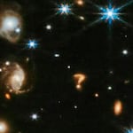 Scientists say the question-mark-shaped structure seen in a new photo from the James Webb Space Telescope is likely the merger of two or more galaxies.