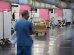 A man walks through a makeshift emergency underground hospital in the parking lot of the Rambam Health Care Campus (RHCC) in Haifa in northern Israel.