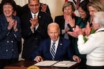 President Biden signs the Social Security Fairness Act during an event in the East Room of the White House on Monday in Washington, DC.