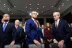 Pete Hegseth, center, President-elect Donald Trump's choice to be Defense secretary, appears before the Senate Armed Services Committee for his confirmation hearing with Rep. Michael Waltz, R-Fla., left, and former Sen. Norm Coleman, at the Capitol in Washington, Tuesday, Jan. 14, 2025.