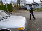 Officer Michael Terrett surveys a recently recovered stolen car during a November 2024 mission. The Portland Police Bureau has been tracking more granular detail about stolen vehicles to improve their ability to find and catch them.