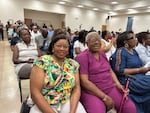 Willie Dixon, left, and Mary Gatson came to hear Alabama's two Black members of Congress speak at a local church on July 30. The ladies are concerned that confusion around congressional boundaries and primary dates may discourage Black voters.