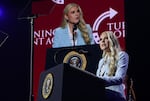 Standing behind a lectern equipped with a microphone, Turning Point USA CEO Erika Kirk speaks during a Turning Point event at Dream City Church in Phoenix on April 17.