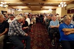 Constituents pack in to watch a debate between Rep. Jaime Herrera Beutler and Carolyn Long.